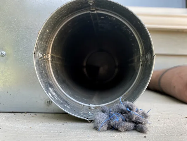 El Segundo Dryer Vent Cleaning technician using specialized equipment to clear severe dryer vent blockage in El Segundo